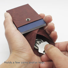 Load image into Gallery viewer, Kamino card wallet holds a few coins and keys.